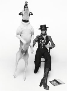 David Bowie poses with a large barking dog for the artwork of his 1974 album 'Diamond Dogs' in London.